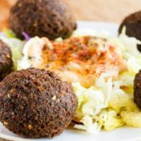 8. Falafel Plate · Fried balls made of a blend of garbanzo beans, parsley, onions, and spices served with pickl...