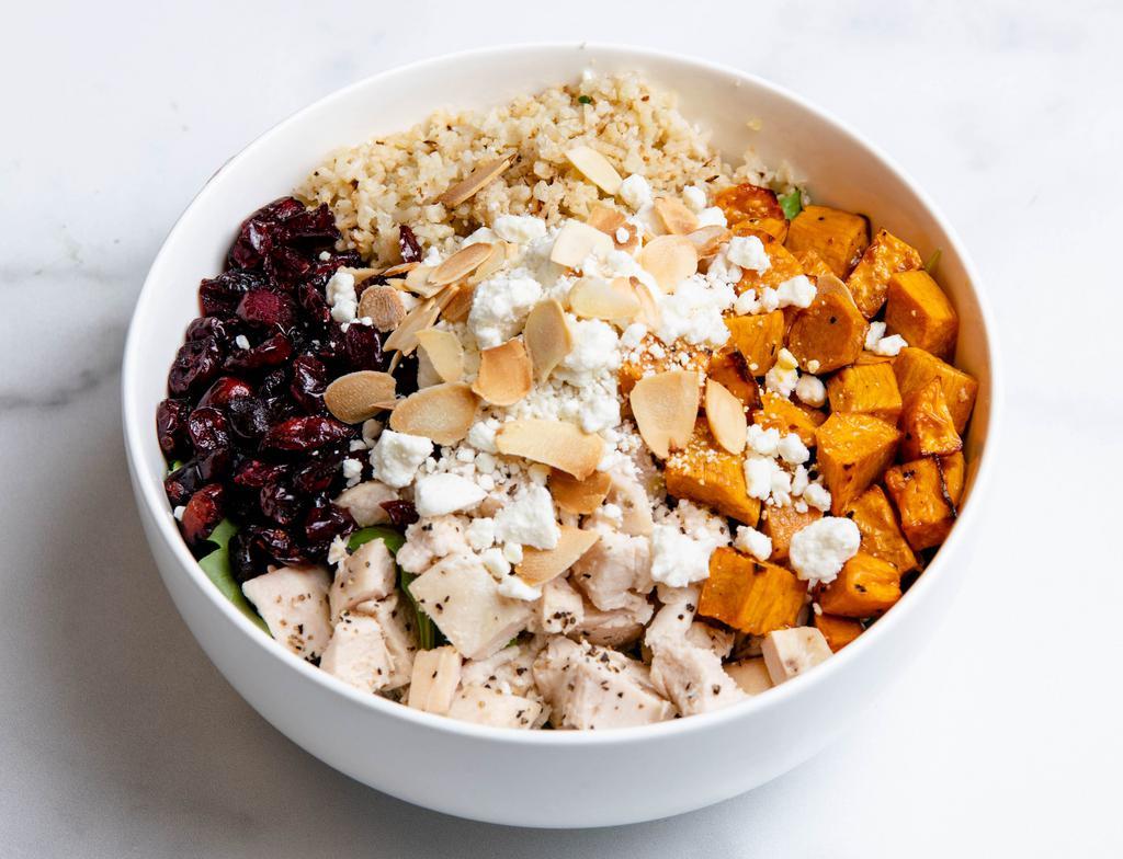 Thrive Sweet Potato + Goat Cheese Bowl · Arugula, roasted sweet potatoes, goat cheese, roasted sliced almonds, dried cranberries, balsamic vinaigrette. Served with a base of your choice and either chicken or roasted sesame tofu.