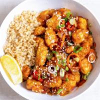 Thrive Orange Chicken Bowl · Oven-fried chicken sautéed with orange sauce, charred peppers, caramelized onions, green oni...