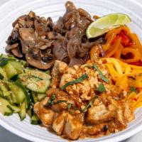 Thrive Peanut Chicken Bowl · Marinated chicken in peanut butter sauce, peppers & onions, citrus-marinated kale, green oni...