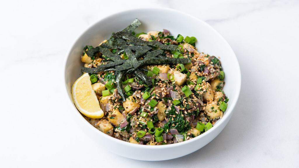 Thrive Sesame Tofu Bowl · Sesame tofu with roasted corn, sauteed mushrooms, charred peppers, citrus-marinated kale, seasoned seaweed, caramelized onions, green onions, sesame seeds, and our creamy sesame sauce. Served with a lemon wedge and a base of your choice. (Gluten-Free & Vegan)