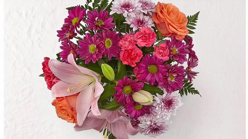 Mixed Flower Bouquet · Mixed flower wrap bouquet includes premium roses, lilies, alstroemerias, mums, chrysanthemum , mixed greenery garnished with a ribbon.