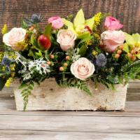 Box of Blooms · Peach and pink Roses, Orchids, Lilies, ranunculus and mixed greenery in a rustic container.