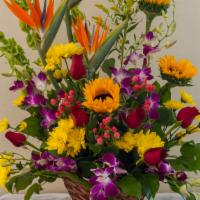 Tropical Special · Tropical arrangement includes: Sunflowers, Birds of paradise, orchids and roses.