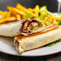 Chicken Shawarma · Served in lavash bread with creamy garlic sauce and pickles, served with Caesar salad.