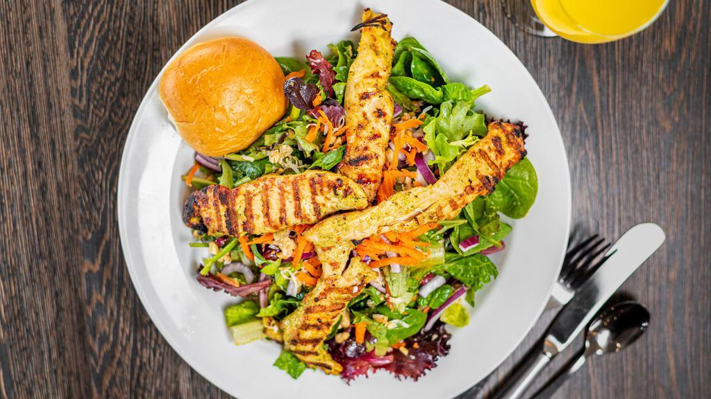 House Special Salad · Mixed greens served with ginger curry and marinated grilled chicken, red onion, mint, shredded carrots, cilantro, roasted peanuts and spicy lemon herb vinaigrette.