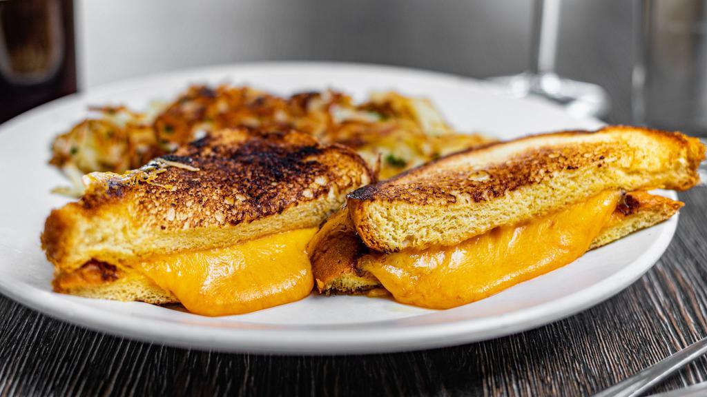 Grilled Cheese · Served with home potatoes or fries.
