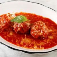 Polpette al Sugo · Beef  meatball trio, parmigiano, tomato, and basil.