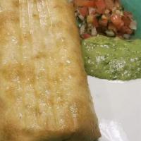 Chimichanga · Deep-fried burrito topped with cheddar cheese.