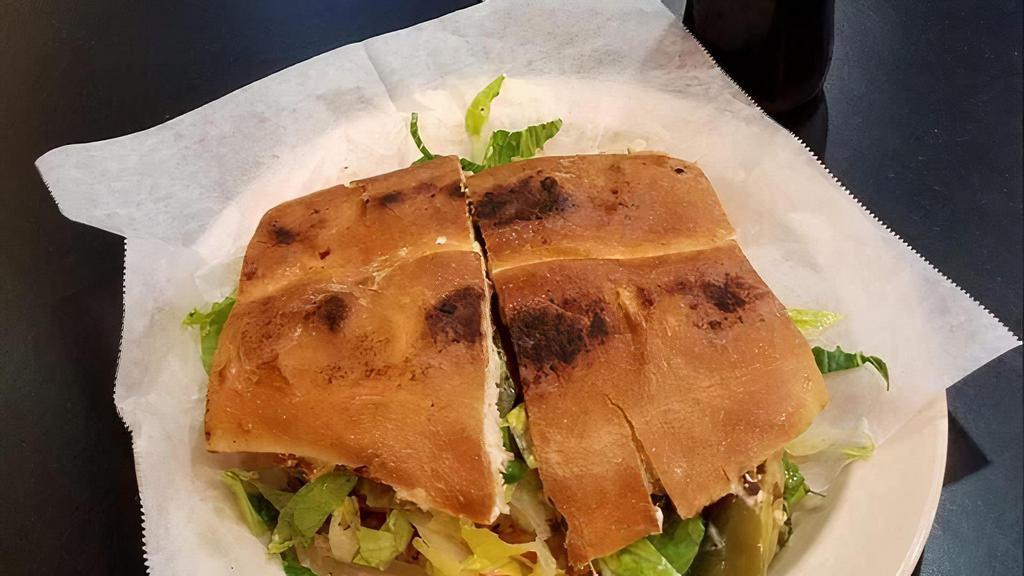 Torta · Choice of meat, lettuce, tomato, sour cream. guacamole, melted cheese on a flatted bread