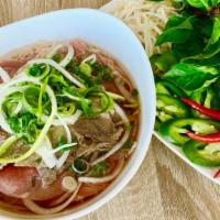 Rare Filet Mignon Steak Pho · Rare FILET MIGNON Steak and Rice Noodles in a Fragrant Beef Both served with Bean Sprouts, B...