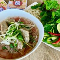 Gogo Combo Pho · Rare FILET MIGNON, Well done Flank Steak , Meat balls and Rice Noodles in a Fragrant Beef Bo...