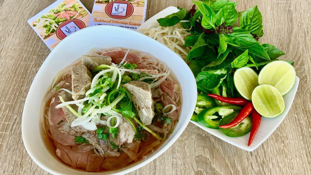 Gogo Combo Pho · Rare FILET MIGNON, Well done Flank Steak , Meat balls and Rice Noodles in a Fragrant Beef Both served with Bean Sprouts, Basil 🌿 , Limes , Hoisin and Chili 🌶  Sauce & Peppers ..