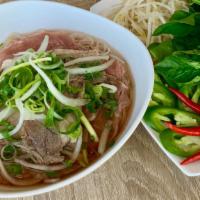 Well-Done Flank Steak Pho · Well done Flank Steak and Rice Noodles in a Fragrant Beef Both served with Bean Sprouts, Bas...