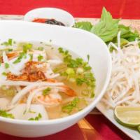 Seafood Pho · Steramed Prawns 🍤  , Squid , Fish 🐠 and Rice Noodles in a Healthy Both served with Bean Sp...