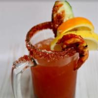 Michelada · House blend of Clamato, chili spices, lime juice, tajin, ice and Model Especial.