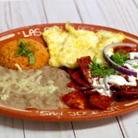 45. Chilaquiles · Fried corn tortillas with a choice of red or green salsa. Topped with onions, cotija cheese ...