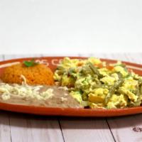 Huevos Con Nopales · Grilled cactus, onion and tomato scramble served with rice, beans and tortillas.