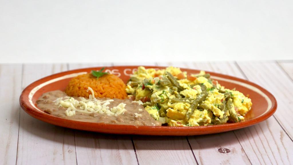 Huevos Con Nopales · Grilled cactus, onion and tomato scramble served with rice, beans and tortillas.