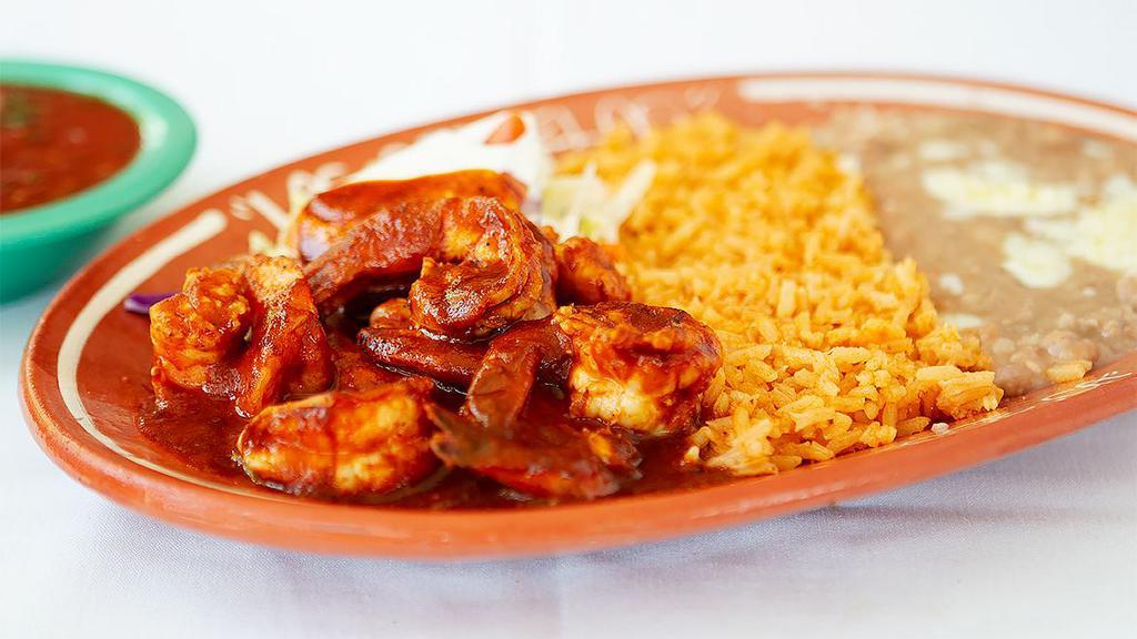 37. Camarones a La Diabla · Shrimp spicy, served with rice, beans and corn or flour tortillas.