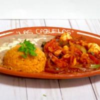 36. Camarones Rancheros · Shrimp sauteed with tomatoes sauce and bell pepper, served with rice, beans and tortillas co...
