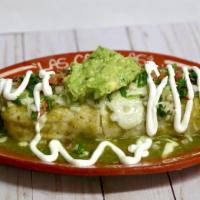 Wet Burrito · Burrito with rice and beans inside, 
Red or Green Sauce,
cheese, guacamole, sour cream and p...