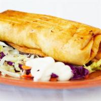 19. Chimichanga Platter · Chicken or beef,  choice of meat, guacamole and sour cream,  with rice and beans.
