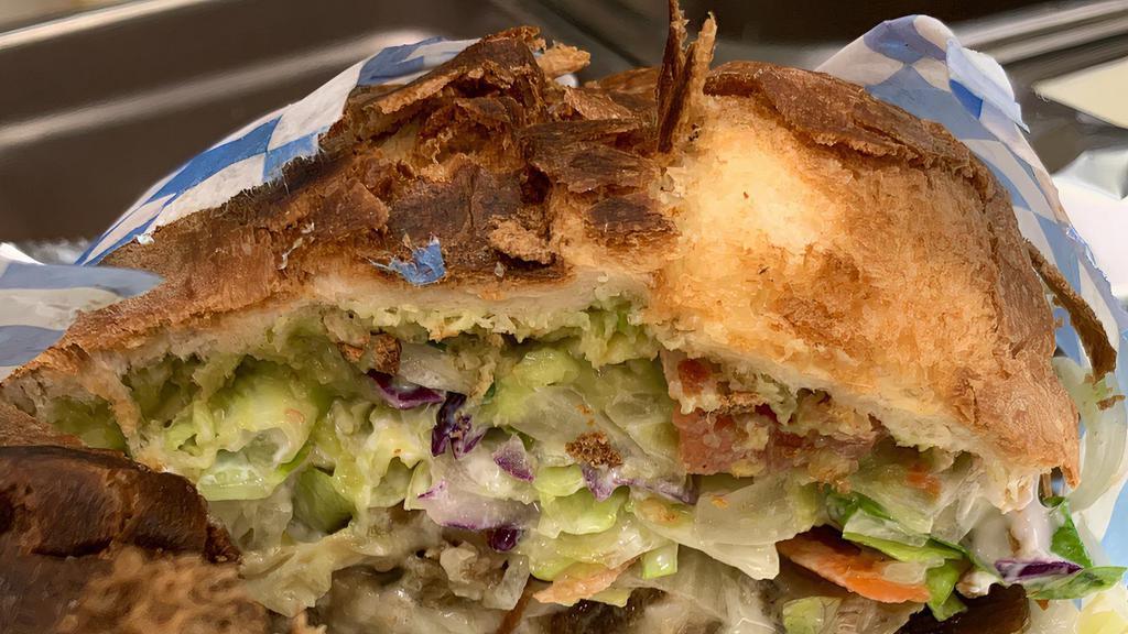 18. Torta Platter · Mexican Bolillo, choice of meat. chicken, beef or carnitas, beans, lettuce, avocado, jalapeno, tomatoes, onions, mayonesa and sour cream Served with rice and beans.