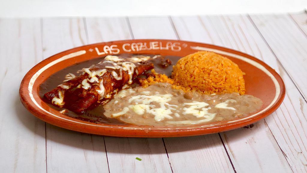 11. One Enchilada Platter · One Enchilada Red Sauce (chicken or ground beef) with rice and beans.