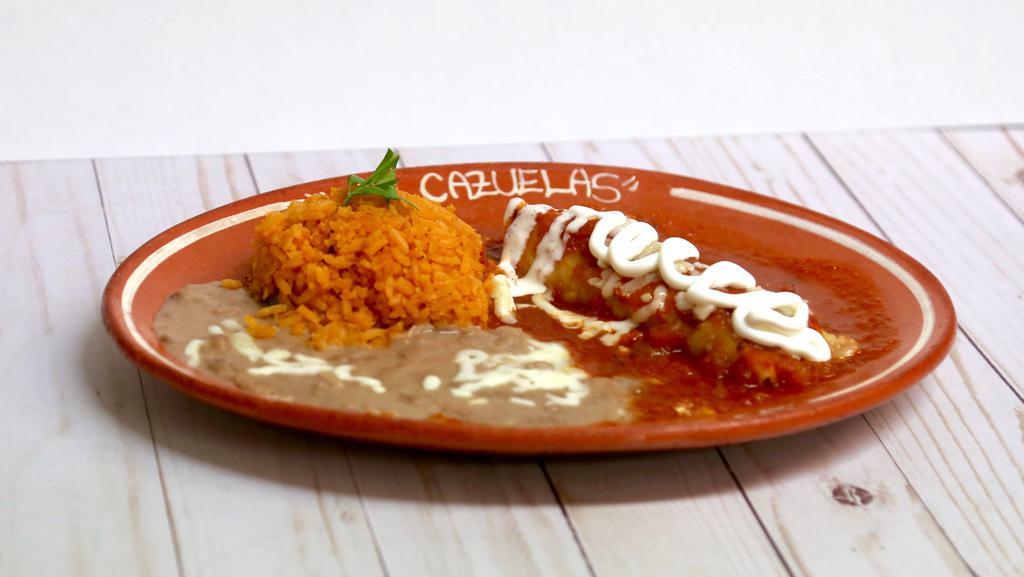 13. One Enchilada Suiza Platter · One Chicken and sour cream. Enchilada, (tomatoes sauce) with rice and beans.
