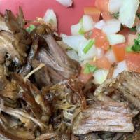 30. Carnitas Plate · Traditional Mexican Pulled pork  with rice, beans and corn or flour tortillas.