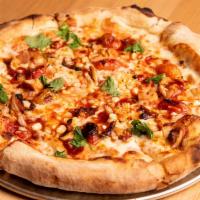 BBQ Bird Pizza · Halal chicken, BBQ sauce, roasted cherry tomato, fresh corn, onions and cilantro with tomato...