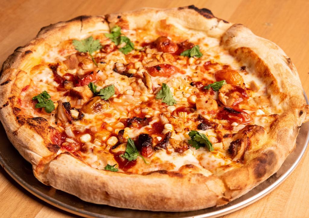 BBQ Bird Pizza · Halal chicken, BBQ sauce, roasted cherry tomato, fresh corn, onions and cilantro with tomato sauce.
