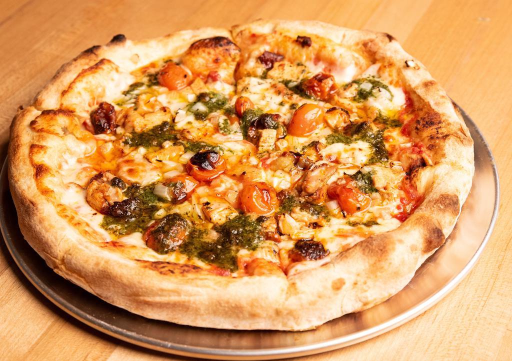 Classic Chicken Pesto Pizza · Halal chicken, pesto, roasted cherry tomato and onions with tomato sauce.