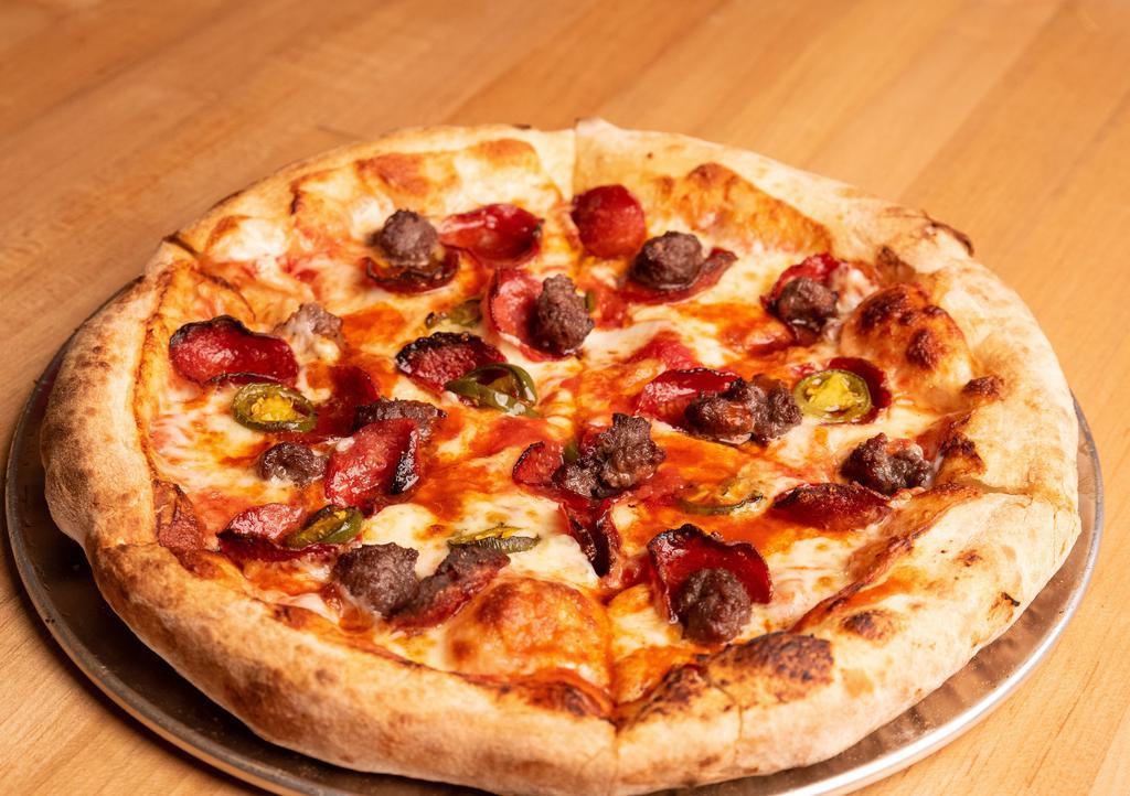 Spicy One Pizza · Halal beef pepperoni, house-made halal beef sausage, house pickled jalapeños and tapatio with tomato sauce.