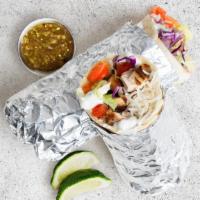 Grilled Chicken Burrito · Grilled chicken with basmati rice, shredded lettuce, diced tomato, and tahini in a flour tor...