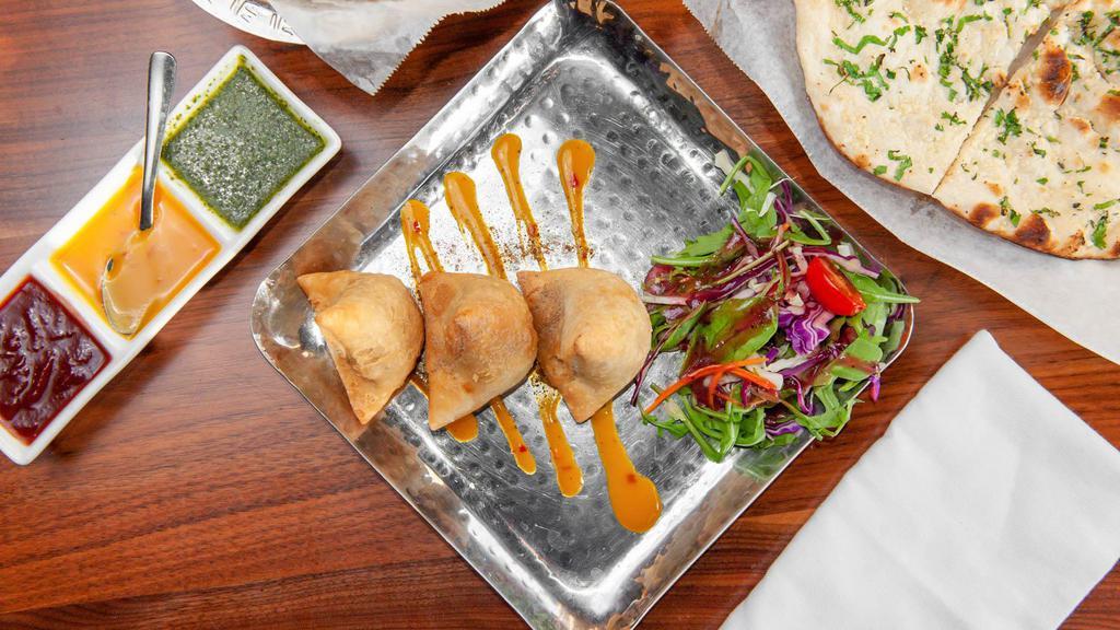 Samosa · Vegetarian, gluten-free. Crisp pastry stuffed with zesty combination of spiced potatoes, onions, and peas.