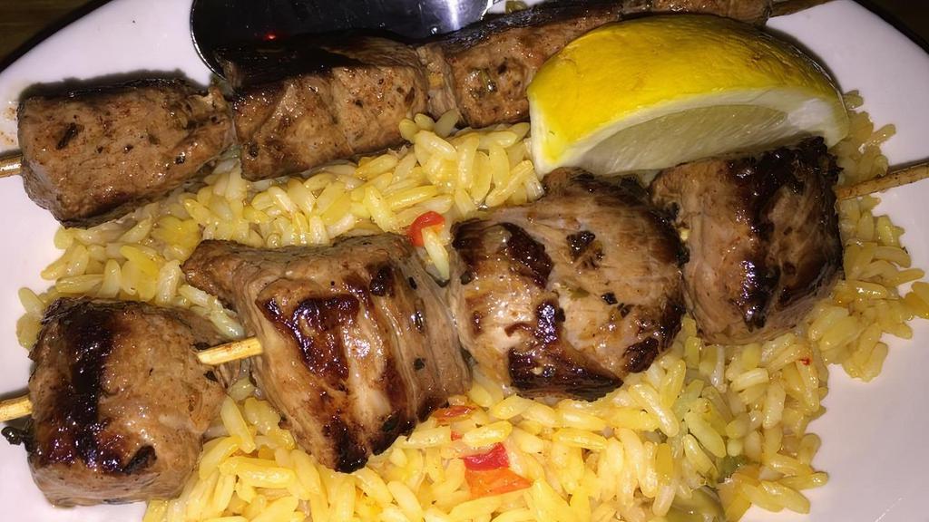 Pinchos Morunos (Aves y Carnes)
 · Pork Kebabs on a bed of Spanish rice.