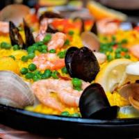 Paella de Mariscos
 · Seafood paella with calamari, shrimp, clams and mussels.