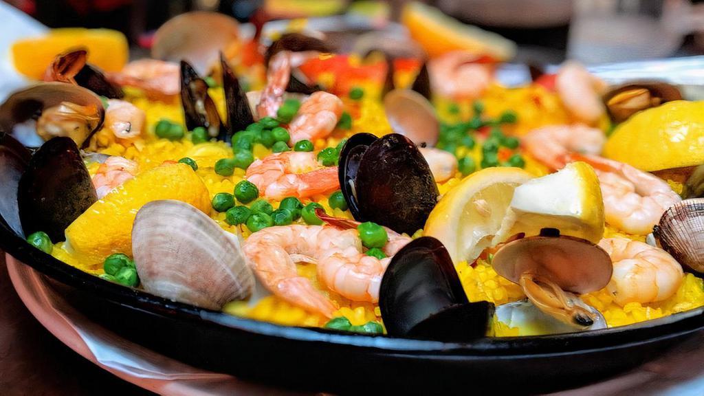 Paella de Mariscos
 · Seafood paella with calamari, shrimp, clams and mussels.