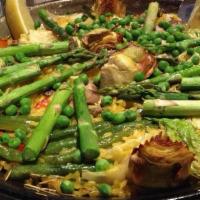Paella Hortelana
 · Vegetable paella with asparagus, artichokes, green beans, mushrooms, red peppers and peas.