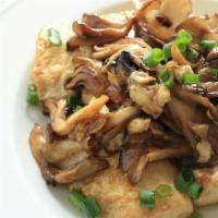 Braised Tofu with Mushrooms · Braised spicy tofu with grilled sautéed mushrooms.