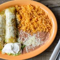 Enchiladas Suizas · Two soft corn tortillas, rolled, and filled with delicious seasoned chicken, topped with our...