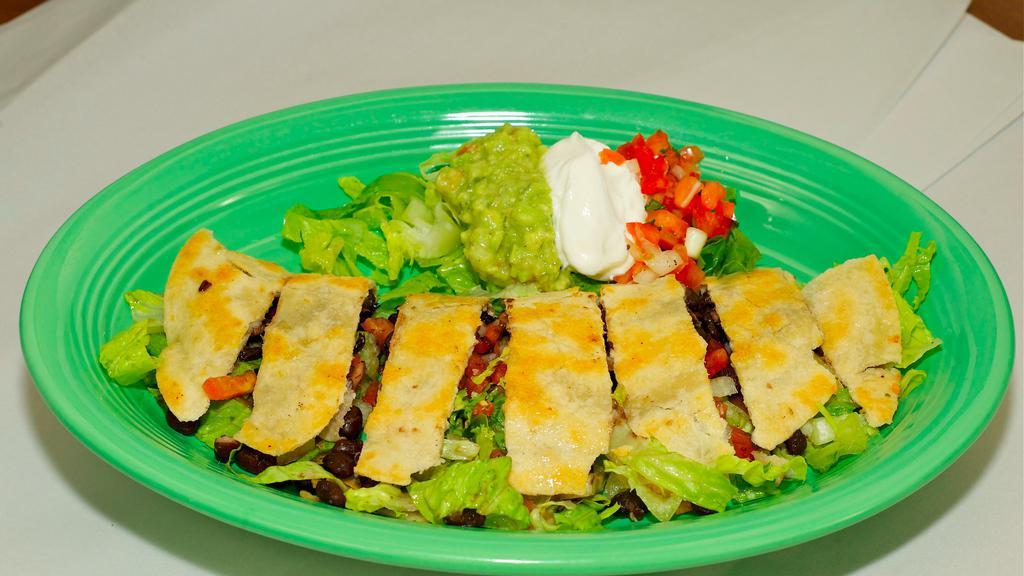 Vegetarian Quesadillas · Cheese, black beans, tomatoes, cilantro, sour cream, lettuce, onions, pico de gallo, and guacamole.