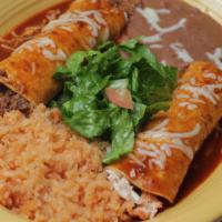 Enchiladas  Rojas · One beef enchilada, one chicken enchilada covered with our delicious red sauce and topped wi...