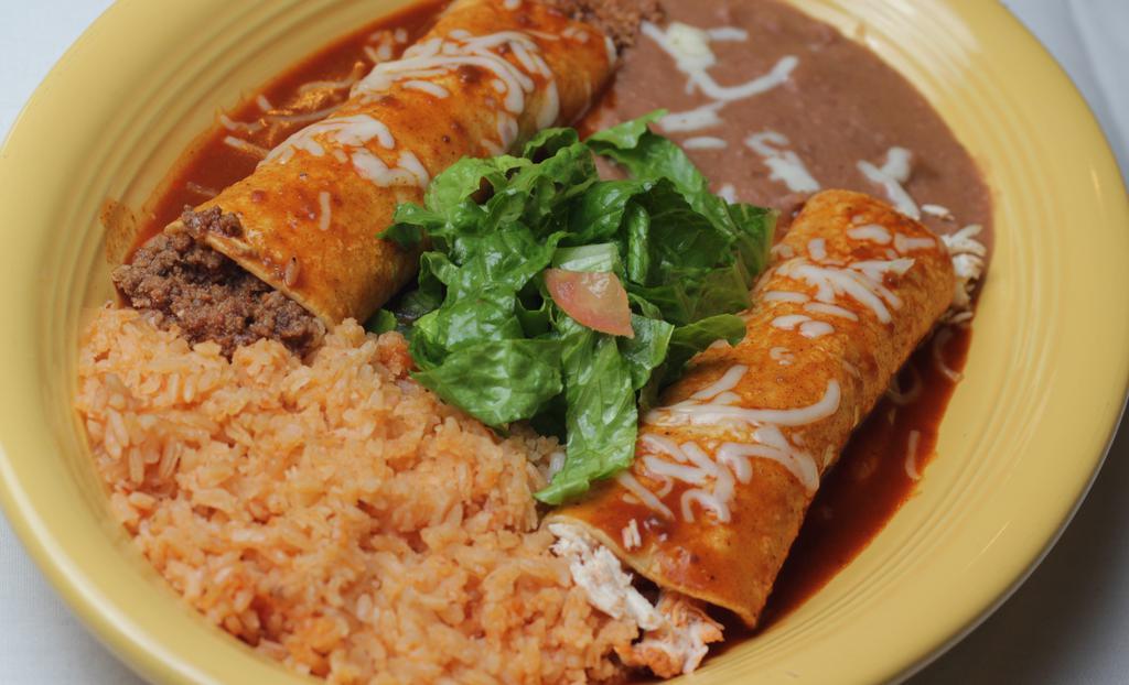 Enchiladas  Rojas · One beef enchilada, one chicken enchilada covered with our delicious red sauce and topped with Jack cheese.