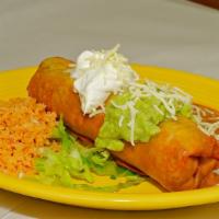 Chimichanga · Shredded chicken or ground beef with beans and cheese in a large flour tortilla
deep fried a...
