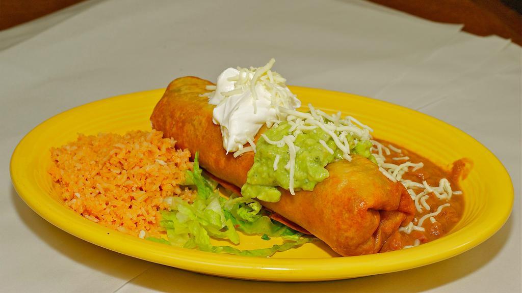 Chimichanga · Shredded chicken or ground beef with beans and cheese in a large flour tortilla
deep fried and topped with our sour cream and guacamole.