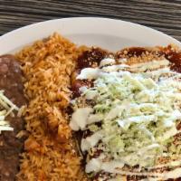 3 Enchiladas Platillo · 3 Hand rolled enchiladas with chicken, topped with lettuce, sour cream, onions, cheese, toma...