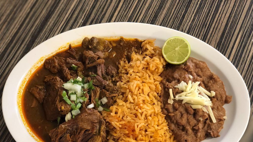 Birria Platillo · Beef Birria ( Shredded Beef ) with a side of rice, beans, tortillas and topped with cilantro and onions.